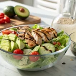 Freshly made Kardashian Salad with grilled chicken and balsamic dressing